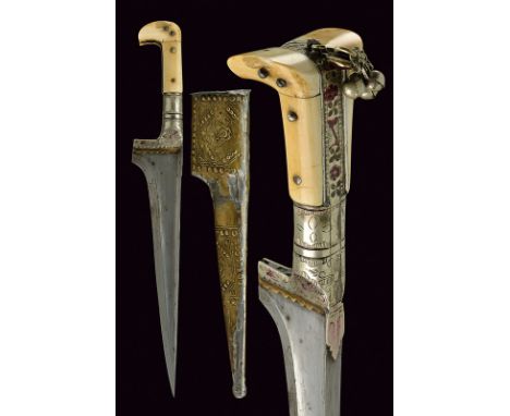 A choora dating: circa 1900 provenance: Afghanistan Straight, single-edged blade with "T"-back; white metallic hilt engraved 