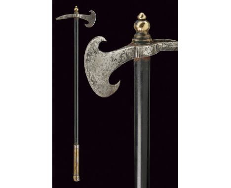 A small war-axe dating: mid-19th Century provenance: Balkans Iron head with round-edged axe, one edge curled toward the haft,