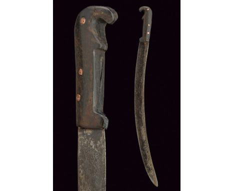 A knife dating: circa 1800 provenance: Sardinia Curved, single-edged blade, decorated near the back with a small frame of cir