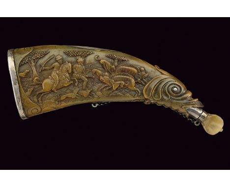 A beautiful carved powder flask dating: last quarter of the 18th Century provenance: Germany Of pressed cow horn; featuring b