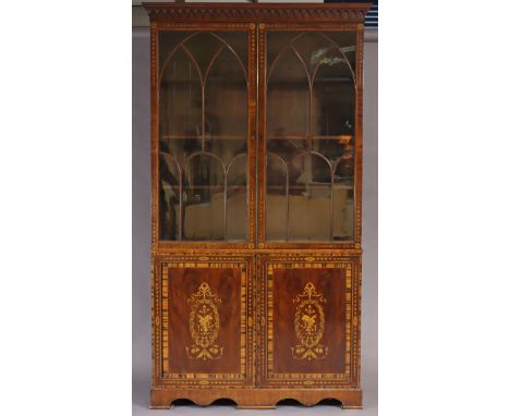 A 19th century marquetry inlaid mahogany tall bookcase, with three adjustable shelves enclosed by pair of glazed doors, four 