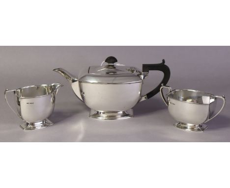 An Art Deco style silver three-piece tea service of rounded oblong form, each on flared rim foot; Sheffield 1940, by Brook &a