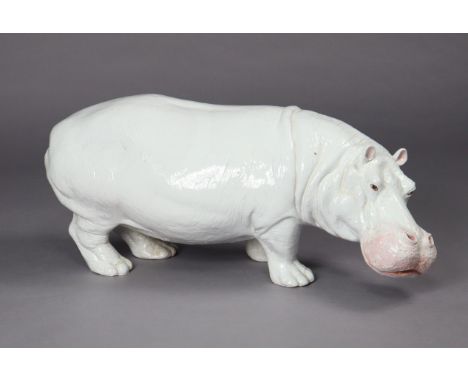 A mid/late 20th century Italian white-glazed earthenware model of a hippo, 82cm long x 30cm wide x 37cm high.