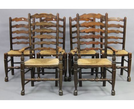 A set of six 19th century oak Lancashire-type rush-seat dining chairs with ladder-backs on turned supports &amp; pad feet, in