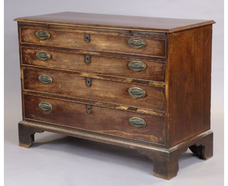 A Georgian mahogany chest fitted with brushing slide above four long graduated drawers with later brass oval handles, on ogee