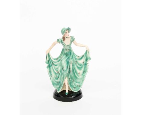 A Goldscheider Pottery model of a woman designed by Josef Lorenzl, model no. 6330, modelled holding her long flowing green dr
