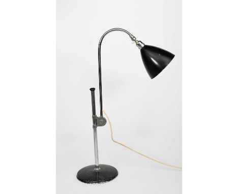 A Bestlite chrome and black enamel anglepoise desk lamp, a standard lamp similar and two other adjustable desk lamps, cast Be