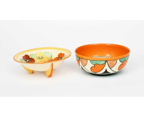 'Double V' a large Clarice Cliff Bizarre bowl, painted in colours between orange and green bands, and a Clarice Cliff Nasturt
