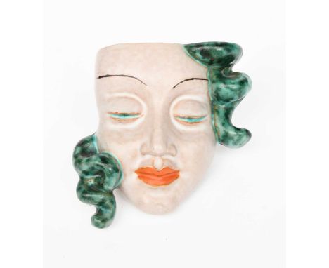 A small Goldscheider Pottery mask, model no.6086, stylised features painted in turquoise and orange printed and incised marks