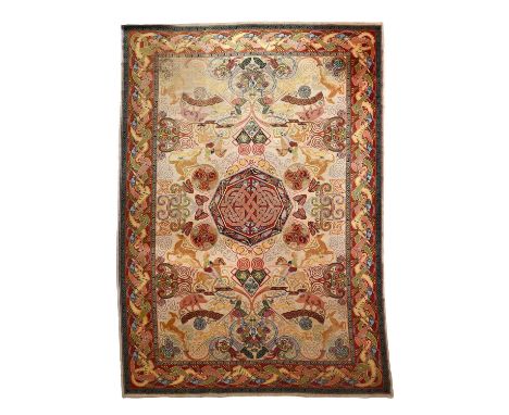 A Quayle & Tranter Hunting machine woven rug designed by George Bain, decorated with a deer hunting scene inside Celtic borde