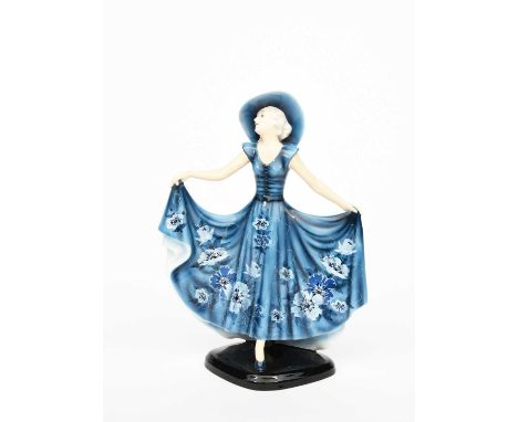 A Goldscheider Pottery model of a lady designed by Stephan Dakon, model no.7581, modelled as a lady in long flowing blue dres