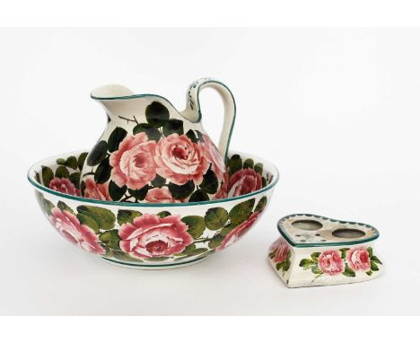 A Wemyss Pottery Cabbage Rose wash basin and ewer, painted in shades of green, pink and brown on a white ground, and a Wemyss