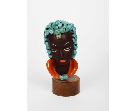 A Goldscheider Pottery bust, modelled with stylised features, glazed turquoise and orange, on wooden drum base, printed and i