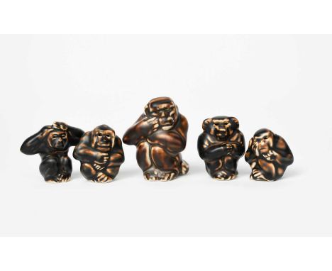 A Royal Copenhagen stoneware model of a seated monkey by Knud Kyhn, model no.20187, four other stoneware monkeys, and two sto