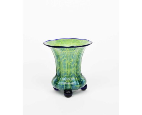 A Loetz glass vase designed by Michael Powolny, swollen, fluted form with flaring neck, pale green with veined blue, applied 