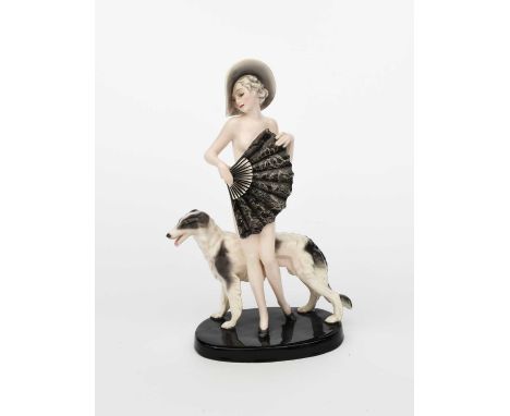 A Goldscheider Pottery model of a lady with a Borzoi by Josef Lorenzl, model no. 7722, modelled as a naked lady standing befo