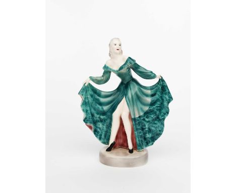 A late Goldscheider Pottery model of a dancer, modelled standing holding the hem of her long green dress, printed and impress