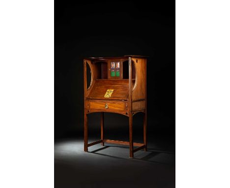 A fine Wylie and Lochhead walnut bureau the design attributed to E A Taylor or George Logan, on slender legs with carved foli