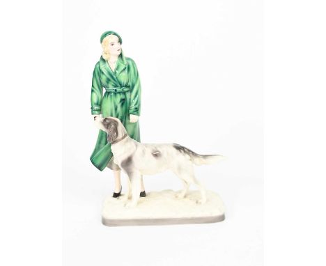 A Goldscheider Pottery model of a lady with a hound designed by Stephan Dakon, model no.6756, glazed in colours, printed fact