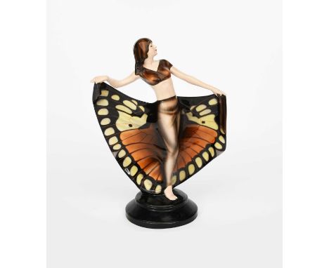 A Goldscheider Pottery Butterfly Girl designed by Josef Lorenzl, model no.5267, modelled standing holding a long flowing Butt
