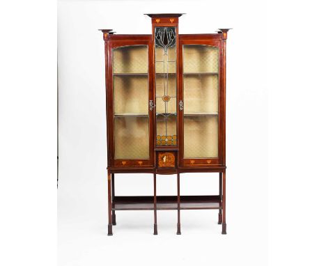 A Scottish Art Nouveau mahogany display cabinet possibly Wylie & Lochhead, central leaded glazed panel with Art Nouveau tulip