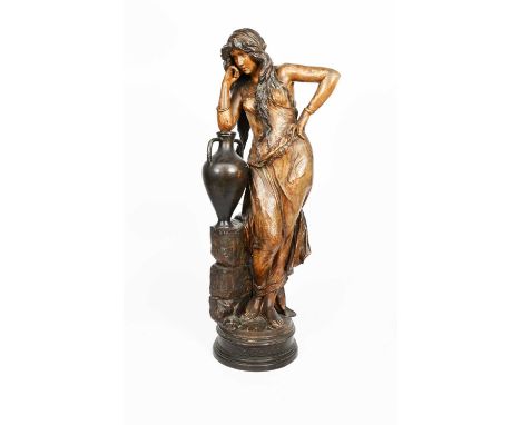 'Rebecca' a tall Art Nouveau Goldscheider Pottery model of a woman resting on a water urn by Cherc, model no. 1903, in colour