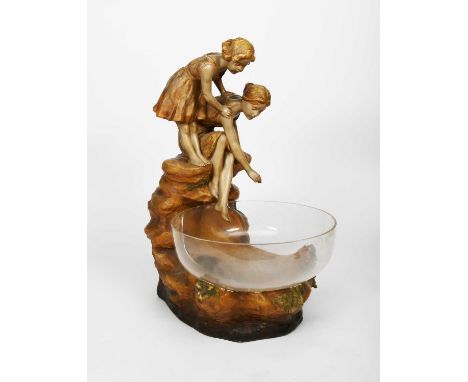 A large Art Nouveau Goldscheider illuminating fish pond designed by Otto Petri, model no.3531, modelled as two young children