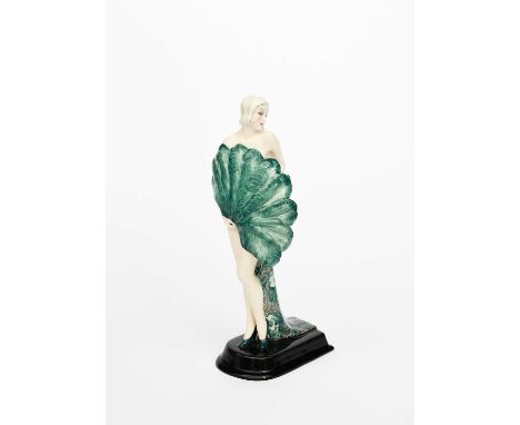 A Goldscheider Pottery model of a woman with a fan designed by Stephan Dakon, model no.6214, the elegant lady modelled holdin