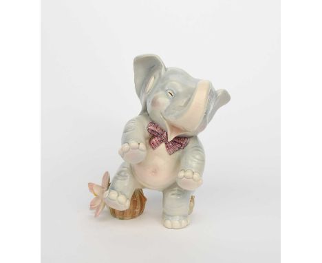 A Lenci Pottery model of a comical young elephant designed by Elena Scavini, model no. 1024, modelled sitting on a cactus, in