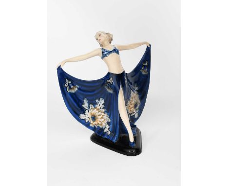 A Goldscheider Pottery model of a dancer designed by Josef Lorenzl, model no.7582, modelled standing with arms outstretched, 