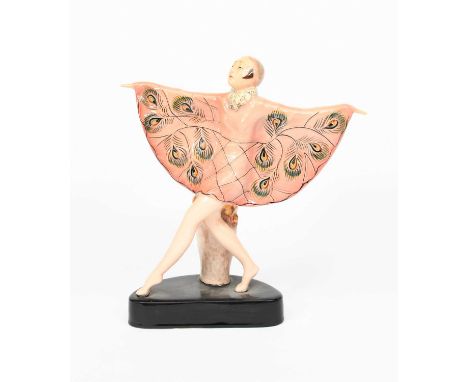 A pottery model of a dancer in the manner of Goldscheider, modelled standing with outstretched arms, the cape modelled in low