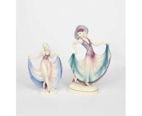 A tall Katshutte Pottery model of a dancer, modelled wearing long flowing dress and broad brimmed hat in purple and blue, and