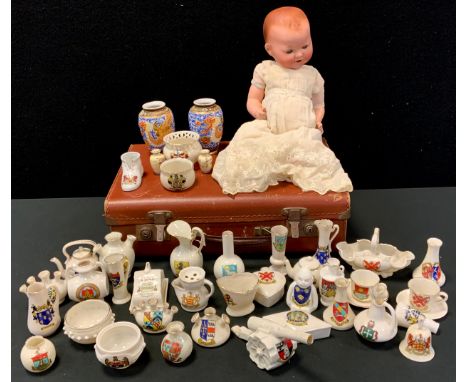 An Armand Marseille bisque head socket doll, 351/3K, sleeping blue eyes, open mouth, composite body and limbs;  near pair of 