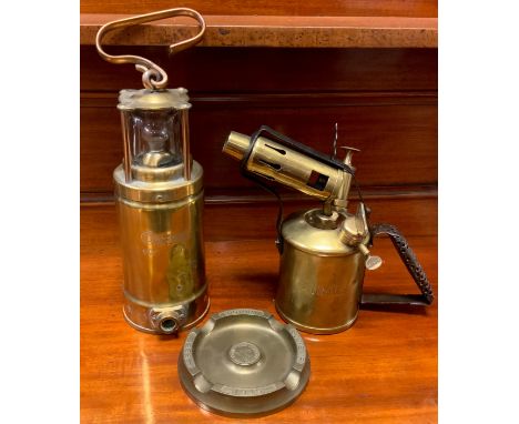 An Oldham all brass No.900-4090 miners lamp, 33 cm high;  Primus blow lamp;  Thos Ryder Ltd Allen Harrison Victory souvenir, 