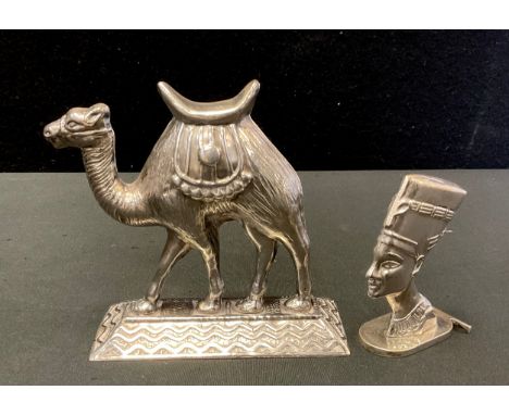 An Egyptian silver model, standing Camel,  impressed marks;  a Nefertiti head seal stamp, impressed marks, 323.1g gross (2) 