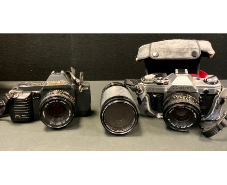 Cameras - Canon T70 35mm SLR camera body, another AE-1, each with 50mm lens,  70-300 zoon lens 