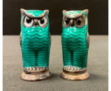 A pair of Norwegian silver-gilt and enamel novelty owl pepper pots, by David Andersen, modelled in standing positions, with g