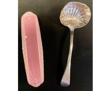 An Irish William IV silver shell bowl sauce ladle, Smith &amp; Gamble, Dublin 1831, 58.7g;  an enamel silver backed brush (2)