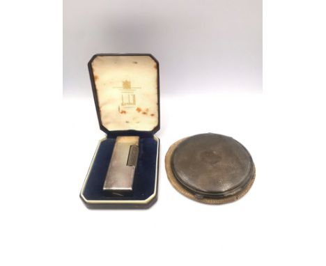 A cased silver Dunhill lighter, marked Made in Switzerland, Dunhill, London with patent LIC USA PAT No 1657352, along with a 