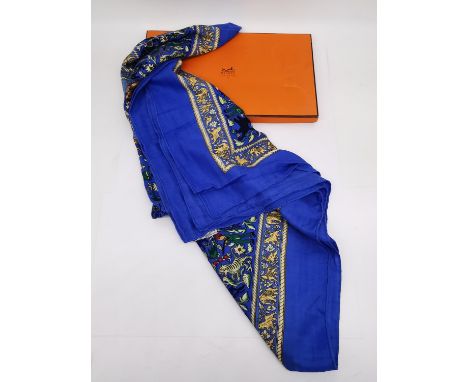 A boxed Hermes 'Chasse en Inde' (blue border) silk and cashmere scarf the by Michel Duchene, 1986. H.132 W.112cm 
