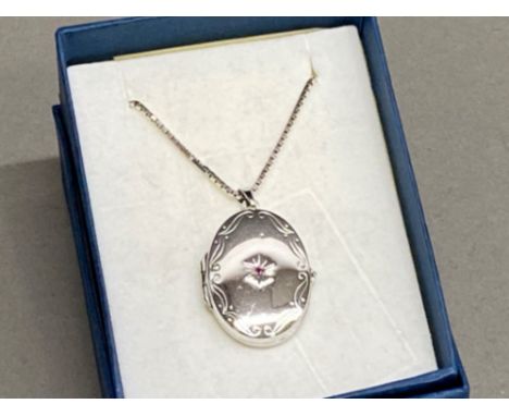 Silver oval locket &amp; chain set with a single Ruby