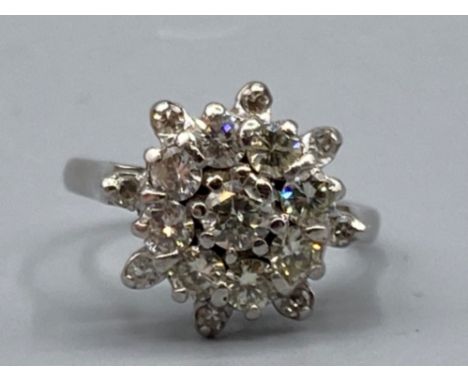 Ladies 18ct white gold diamond cluster ring, comprising of seventeen round brilliant cut diamonds set in a claw setting, 4.6g