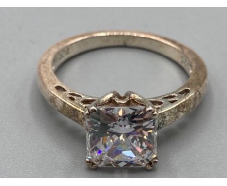 A silver and CZ solitaire ring size P 3.9g gross