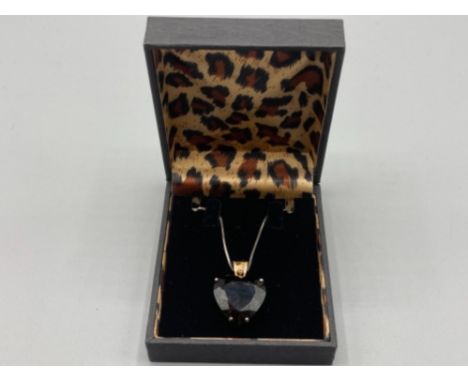 A silver enamel and smoky quartz heart shaped pendant on silver chain by Chateau D’Argent