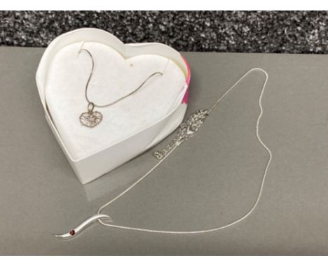 Silver necklace with wire woven heart pendant by Magnolia (with original box) together with a metal &amp; red stone pendant o