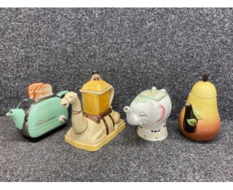 Four Novelty teapots by makers to include Swineside Teapottery, Tony Wood and Carlton Ware