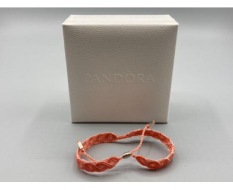 A woven cotton bracelet by Pandora with silver mounts in original box with sleeve