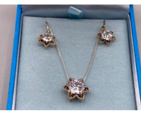 Silver and CZ pendant on silver chain and matching earrings