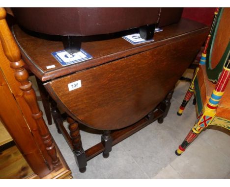 An oak barley twist gate leg table