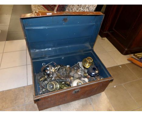 A tin trunk full of oil lamp parts etc